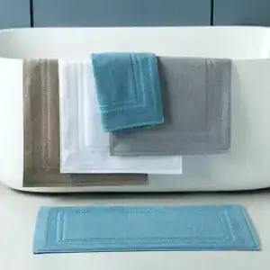 Alfombra de baño de hotel en algodón