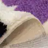 Alfombra baño lunares, textura suave y borde cosido.