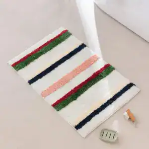 Alfombra de baño de lunares