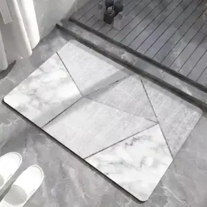 Alfombra de baño gris y blanca