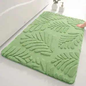 Alfombra de baño verde pistacho con hojas