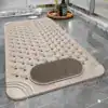 Alfombra para ducha o bañera con textura de puntos y área de cepillado.