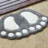 Alfombra de baño con forma de pies