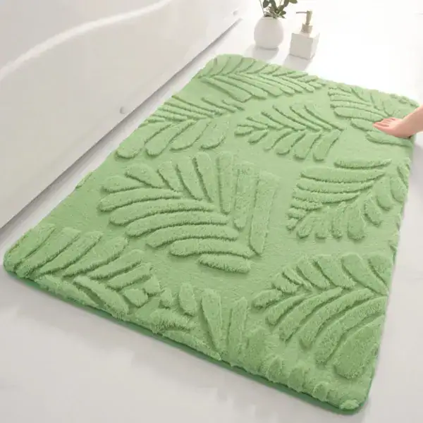 Alfombra de baño verde pistacho con hojas